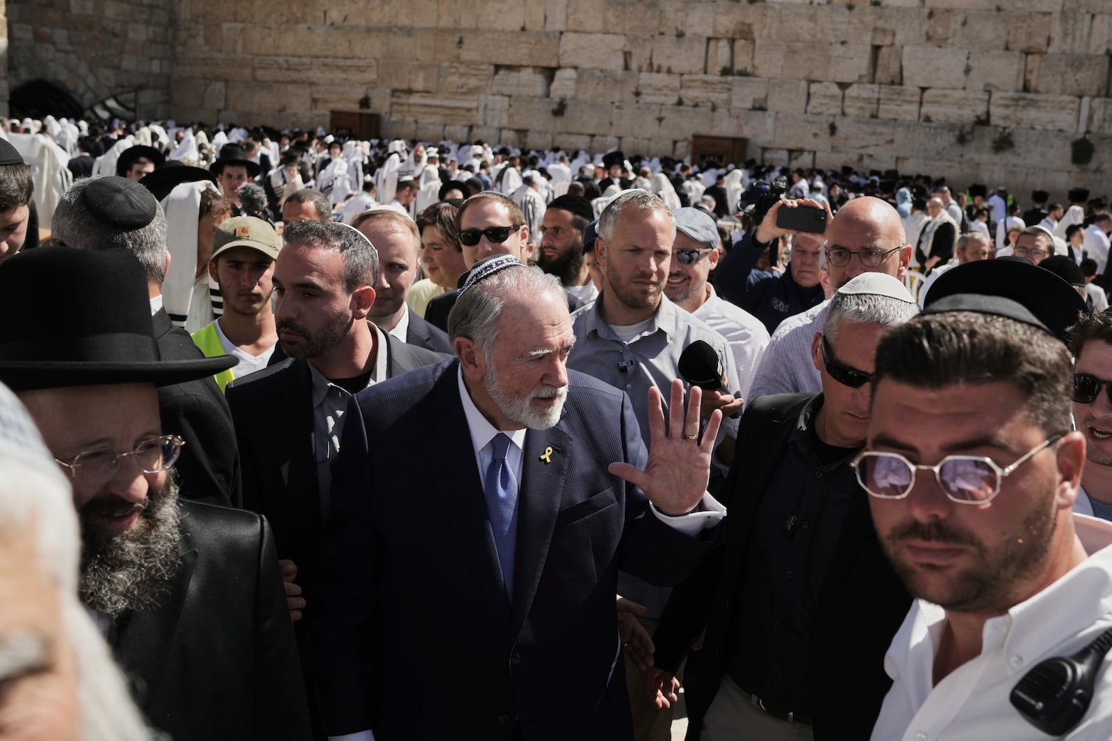 US ambassador to Israel Mike Huckabee, center, visits the Western Wall, the holiest site where Jews can pray, in the Old City of Jerusalem, Friday, April 18, 2025. (AP Photo/Leo Correa)