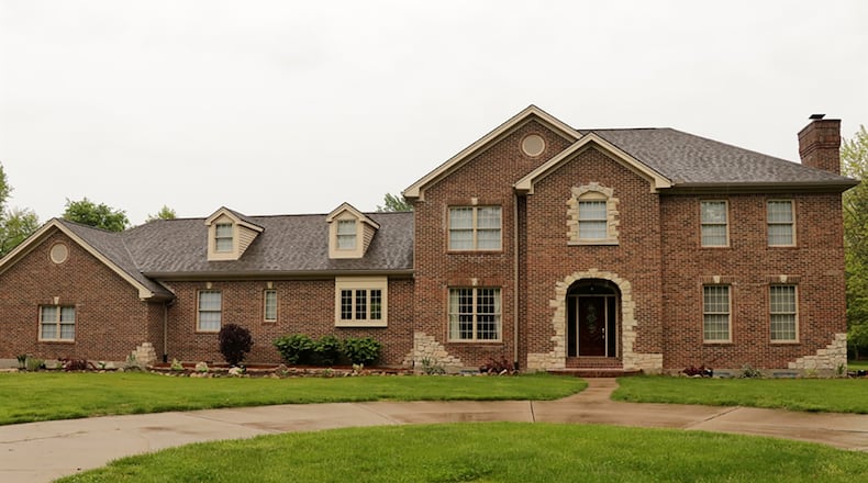 The 2-story has about 5,240 sq. ft. of living space plus a finished basement. A side-entry, 3-car garage is hidden by a brick accent wall. The home sits on sits on 3.62 acres within the Hampton Farms Estates of Washington Twp. CONTRIBUTED PHOTO BY KATHY TYLER