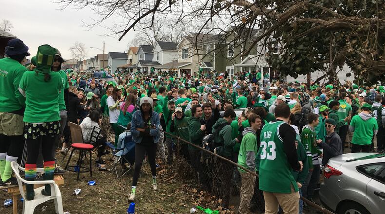 Police in riot gear dispersed a large crowd that gathered on Lowes Street in Dayton during St. Patrick’s Day celebrations Saturday March 17, 2018. Steve Maguire/Staff