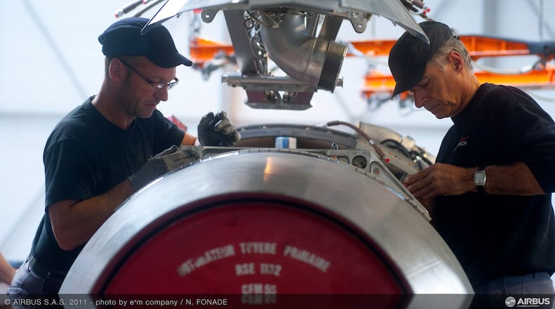 A CFM56 engine built by CFM International in West Chester Twp. is readied for installation on the A320 final assembly line at an Airbus factory in this 2014 photo. CONTRIBUTED.