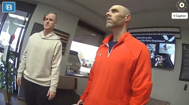 Tipp City Police bodycam footage shows Caleb Flynn in handcuffs asking a detective why he is being charged. TIPP CITY POLICE