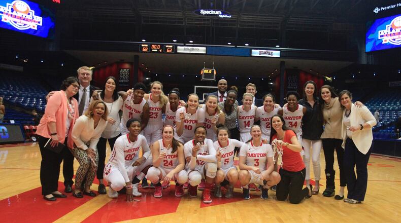 Dayton poses for a team photo after beating Saint Louis in 2017 to clinch a share of the regular-season title at UD Arena. David Jablonski/Staff