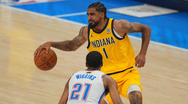 Indiana Pacers forward Obi Toppin (1) looks to pass as Oklahoma City Thunder guard Aaron Wiggins (21) defends during the first half of Game 5 of the NBA Finals basketball series, Monday, June 16, 2025, in Oklahoma City. (AP Photo/Nate Billings)