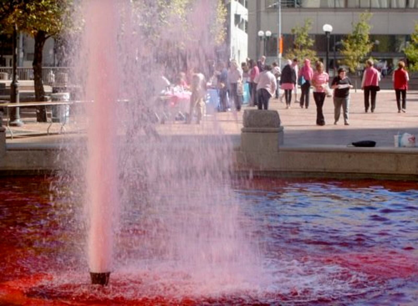 Pink water sprays from the fountain at Courthouse Square on Friday, Oct. 1, as the the Breast Cancer Task Force of the Greater Miami Valley kicked off Breast Cancer Awareness Month with the Paint the Square Pink event at the square.