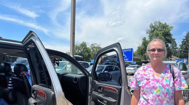 Christine Bledsoe, 60, of Dayton, recently purchased a 2006 GMC Denali. She said new and used car prices are "ridiculous" right now. CORNELIUS FROLIK / STAFF