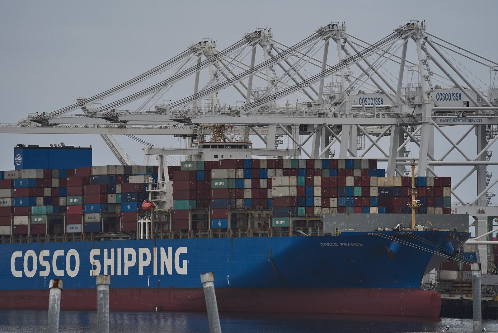 FILE -The "Cosco Shipping France" container ship is moored at the Long Beach Container Terminal, LBCT, at Middle Harbor in the Port of Long Beach, Calif., , April 15, 2025. (AP Photo/Damian Dovarganes, File)