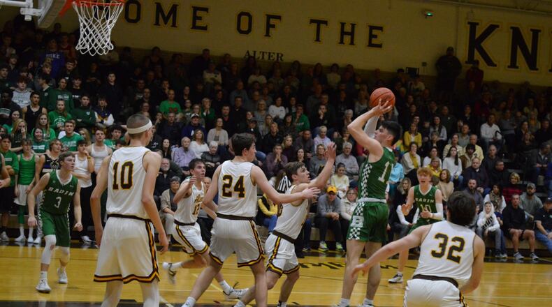 Badin’s Spencer Giesting puts up a shot in the lane surrounded by Alter players during Friday night’s game. The Knights won 45-42. Eric Frantz/CONTRIBUTED