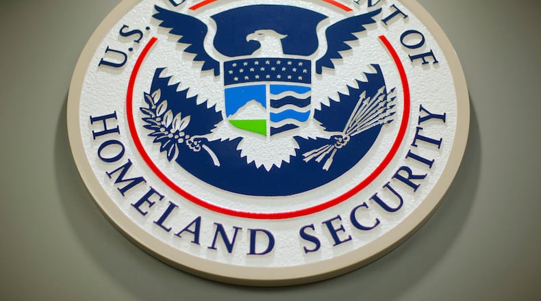 FILE - The Department of Homeland Security logo is seen during a news conference in Washington, Feb. 25, 2015. (AP Photo/Pablo Martinez Monsivais, File)