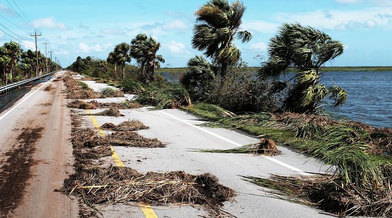 NAPLES, FL - SEPTEMBER 11: A road with heavy debris stands on the outskirts of a rural part of Naples the day after Hurricane Irma swept through the area on September 11, 2017 in Naples, Florida. Hurricane Irma made another landfall near Naples yesterday after inundating the Florida Keys. Electricity was out in much of the region with extensive flooding. (Photo by Spencer Platt/Getty Images)