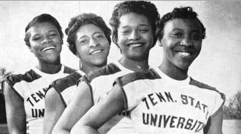 Lucinda Williams (right) poses with Tennessee State Tigerbelles teammates (left to right) Isabelle Daniels, Margaret Matthews and Barbara Jones. Photo courtesy of Tennessee State University.