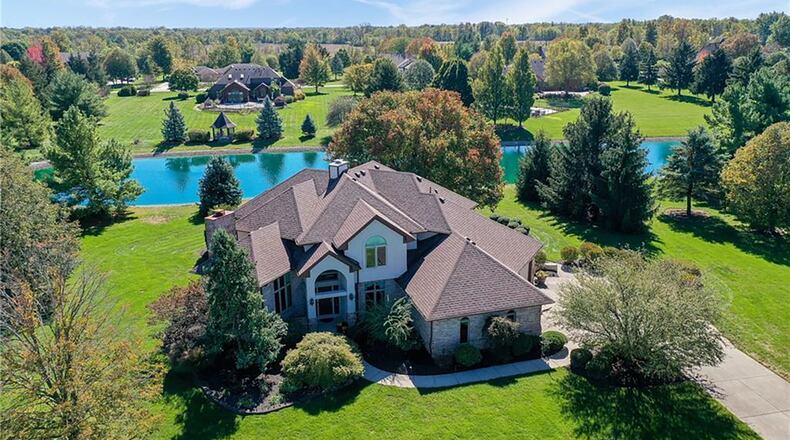 The custom built brick two story in Clayton sits on two plus acres and overlooks a sizeable and well maintained pond.