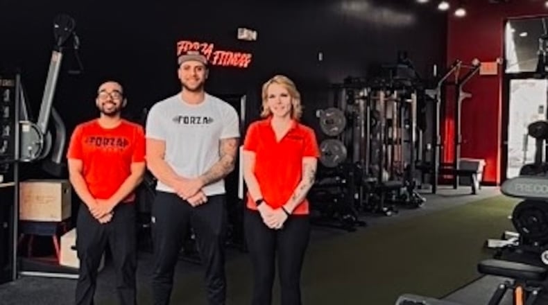 Forza Fitness owner Dominic Anastasio, center, is flanked by trainers Jonathan Catedral and Rachel Golem. The new gym is at 3012 Far Hills Ave. in Kettering near East Dorothy Lane. CONTRIBUTED