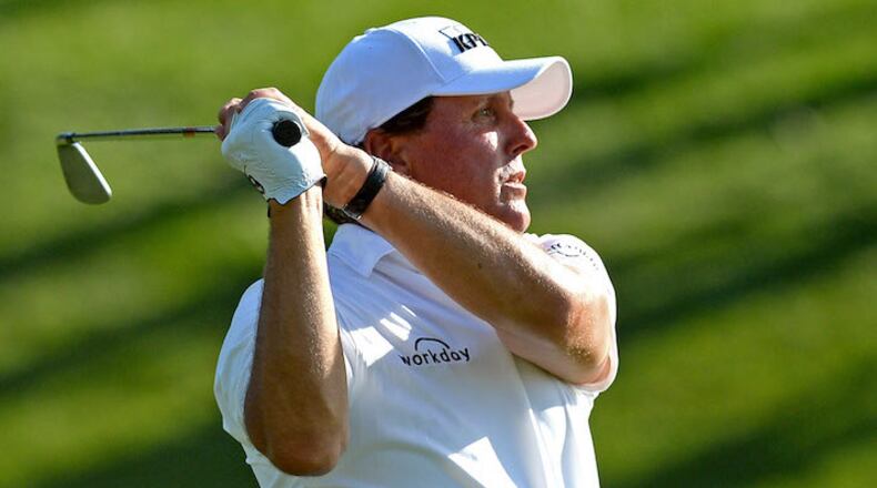 Phil Mickelson watches his second shot from the 18th fairway during the second round of the Wells Fargo Championship at Quail Hollow Club in Charlotte, N.C., on Friday, May 4, 2018. (Jeff Siner/Charlotte Observer/TNS)