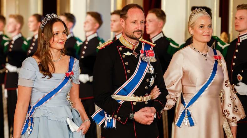 FILE - From left, Norway's Princess Ingrid Alexandra, left, Crown Prince Haakon and Crown Princess Mette-Marit on their way to a gala dinner at the Palace in Oslo, Tuesday, April 8, 2025. (Fredrik Varfjell/NTB via AP, File)