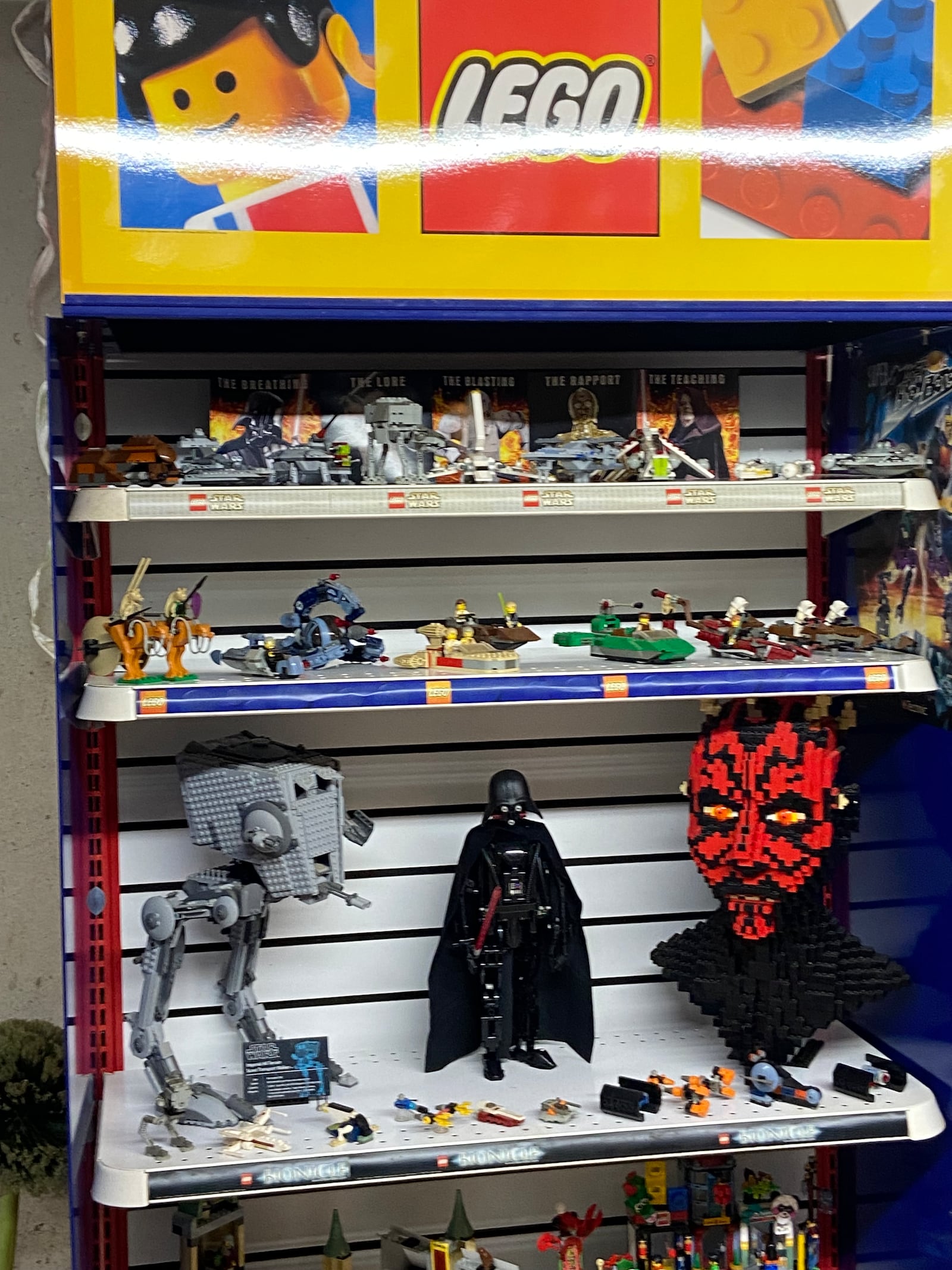 Secondhand LEGO toy store shelving gives Marvin  Gale added display space for small and large figures. CONTRIBUTED