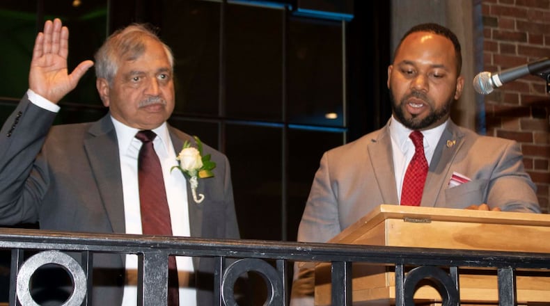 Sham Reddy, 2020 President of Dayton Realtors is sworn in by Montgomery County Recorder Brandon McClain. CONTRIBUTED