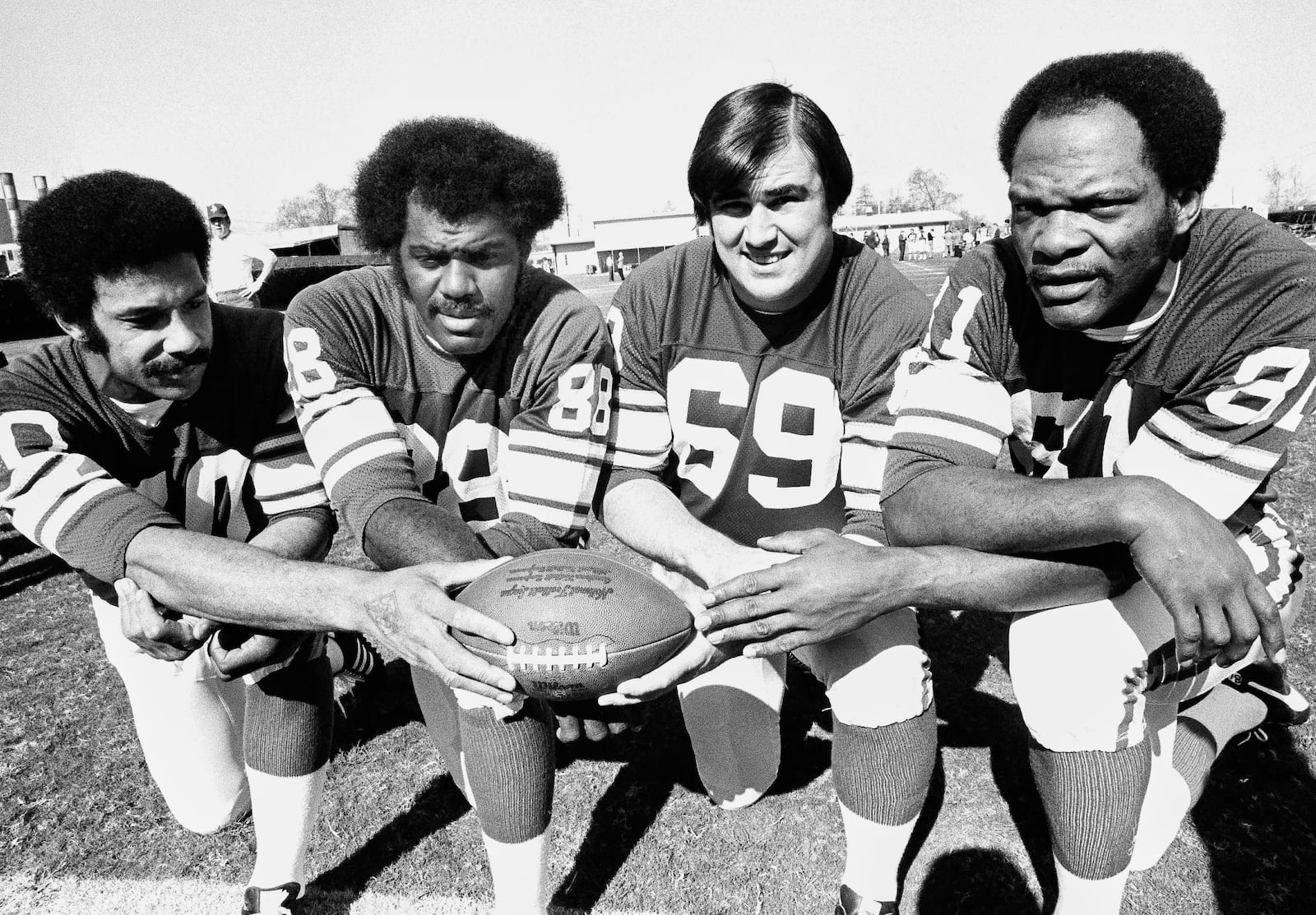 FILE - This Jan. 9, 1975, file photo shows from left, Minnesota Vikings defensemen Jim Marshall, Alan Page, Doug Sutherland and Carl Eller nicknamed the "Purple People Eaters" for their bruising defensive line from the late 1960s through the 1970s. (AP Photo/File)