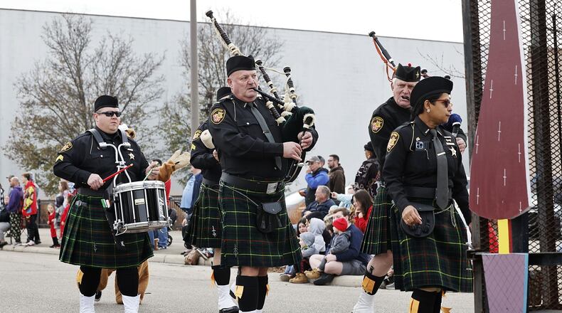 The inaugural St. Patrick's Day Parade in Middletown, which steps off at 4 p.m. March 16 from Curtis Street and Central Avenue and travels down Central to Governor's Square, is expected to be large with more than 30 groups and floats, including two pipe and drum bands: the Butler County Sheriff's Office Pipe and Drum Corp and the Cincinnati Caledonian Pipes & Drums. Above is a pipe and drum band that participated in the 2022 Santa Parade. NICK GRAHAM/STAFF