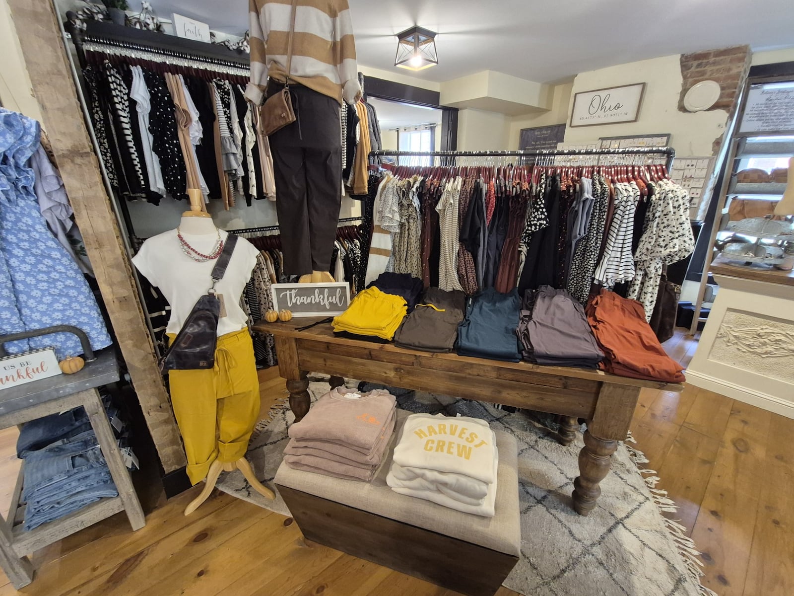 Betsey's Boutique Shop sales associate Jessica Matemu said she thins Christmas in Old Springboro will drive a lot of foot traffic during the shopping season. MICHAEL KURTZ / STAFF