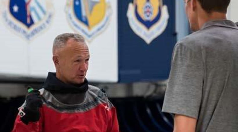 NASA astronaut Douglas Hurley speaks with a NASA engineer just before getting into the Air Force Research Laboratory’s centrifuge. Ten astronauts participated in the testing at Wright-Patterson Air Force Base Nov. 1-2 – one with Boeing and nine with NASA. (U.S. Air Force photo/Richard Eldridge)