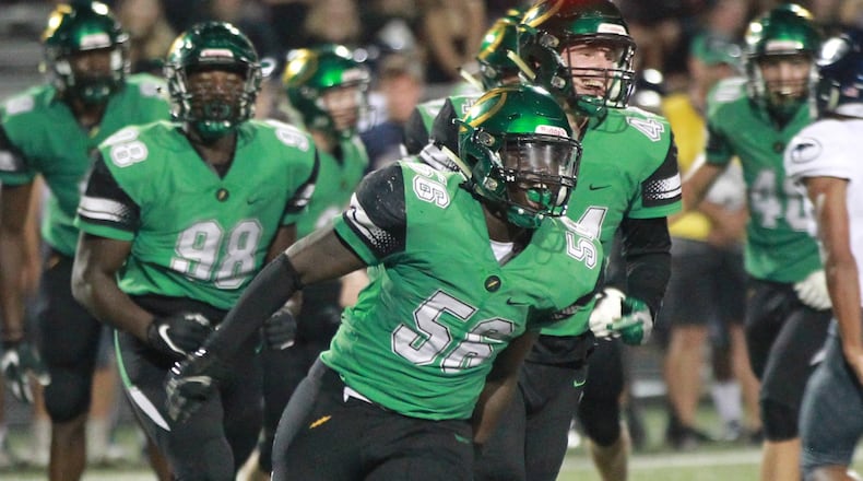 Northmont defenders Phillip Quansah (56) and Shaun Myers (44) celebrate a stop. Northmont defeated visiting Fairmont 28-14 in a Week 3 high school football game on Friday, Sept. 13, 2019. MARC PENDLETON / STAFF