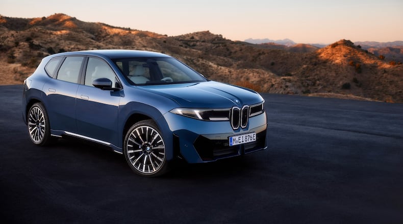 This photo provided by BMW shows the BMW iX3, a luxury electric SUV that should offer about 400 miles of range along with sporty performance. (Courtesy of BMW of North America via AP)