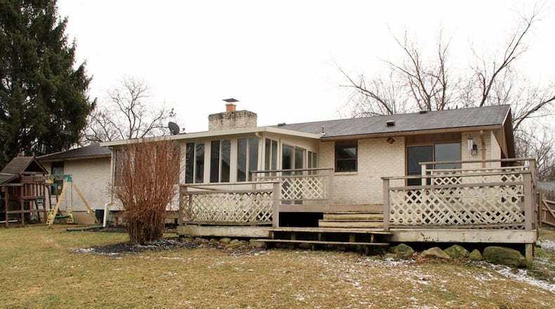 Patio doors off the breakfast room open to a multi-level wooden deck that wraps around to the covered side patio. The Florida room has screened windows, carpeting and added electrical service, allowing for possible 4-season use.
