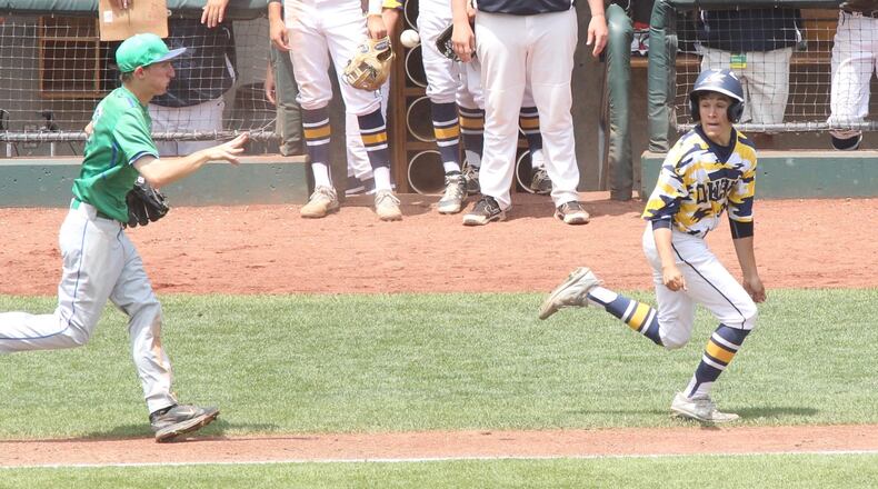 Chaminade Julienne’s Mark Barhorst, right, chases Tallmadge’s Garrett Sands in a rundown between third and home in the Division II state championship on Saturday, June 3, 2017, at Huntington Park in Columbus. David Jablonski/Staff