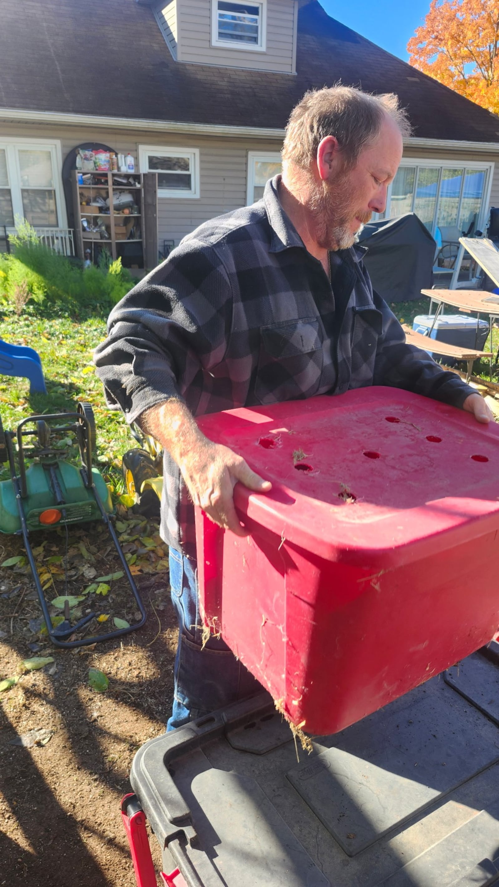Todd Combs of Kettering helps pack up 12 of his hens for rehoming in Spring Valley in Greene County. CONTRIBUTED