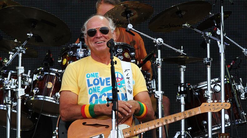 GULF SHORES, AL - JULY 11:  Musician Jimmy Buffett performs onstage at Jimmy Buffett & Friends: Live from the Gulf Coast, a concert presented by CMT at on the beach on July 11, 2010 in Gulf Shores, Alabama.  (Photo by Rick Diamond/Getty Images for CMT)