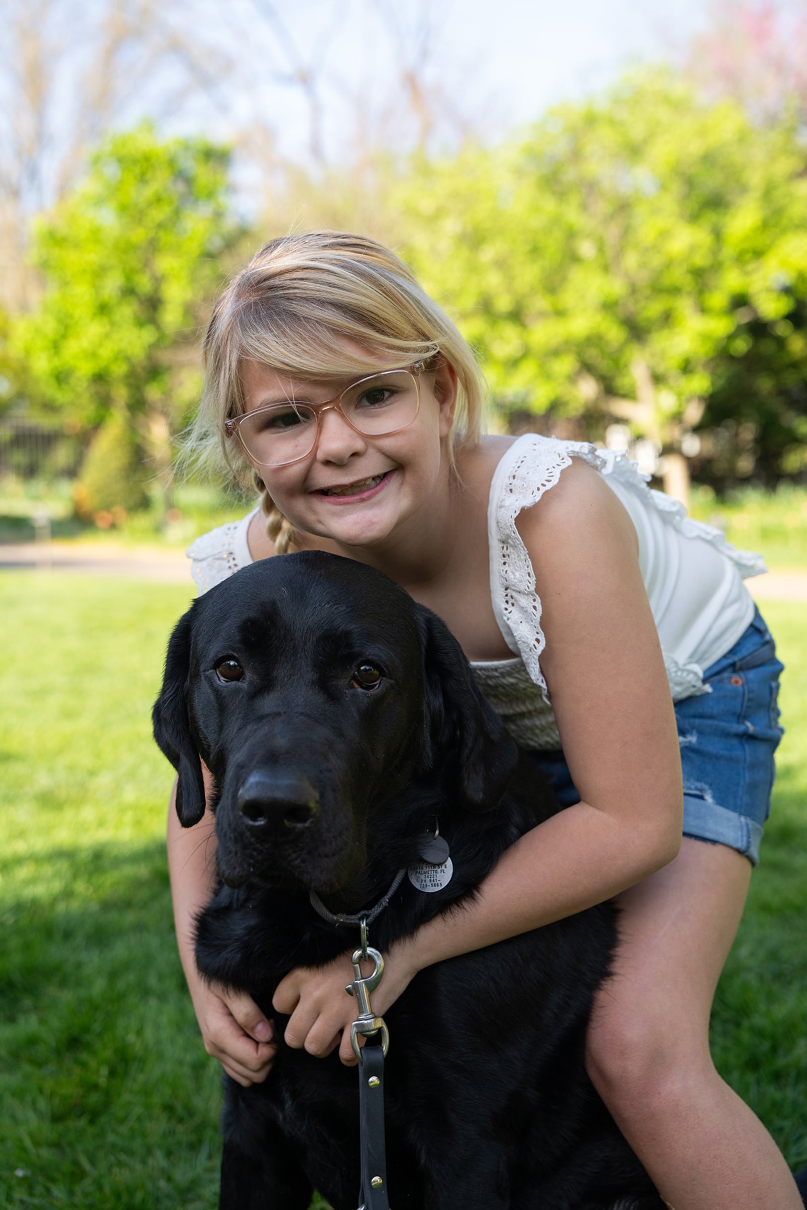 Emma and Sloane, her skilled companion dog. Sloane was matched with Emma by Dogs, Inc. and was provided to the family at no charge. Emma's parents say he has changed Emma's personality and helped her regain her positive attitude. CONTRIBUTED.