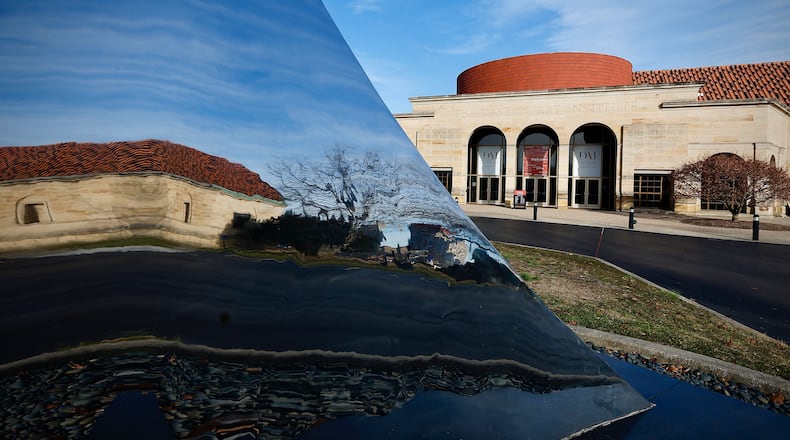 The Dayton Art Institute and partially reflected in the Pathway sculpture. MARSHALL GORBY\STAFF