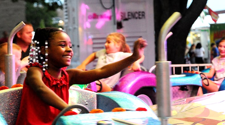 Rides, games of chance, beer, live music and food are part of the Labor Day weekend fun at AlterFest 2021. DAVID MOODIE/CONTRIBUTED