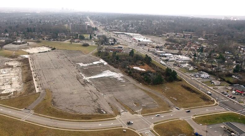 Outlines of retail building foundations and a parking lot are all that remains of the Forest Park shopping center on North Main Street in Harrison Township. County Corp, in partnership with Harrison Township and Montgomery County will facilitate the first public meeting to initiate feedback on the Forest Park Area Plan on Monday, January 29th at Horizon Science Academy. TY GREENLEES / STAFF