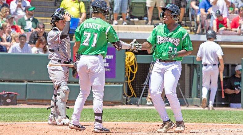 Cam Collier is greeted by Cade Hunter in the fourth inning Sunday at Day Air Ballpark after hitting his 10th home run. Jeff Gilbert/CONTRIBUTED