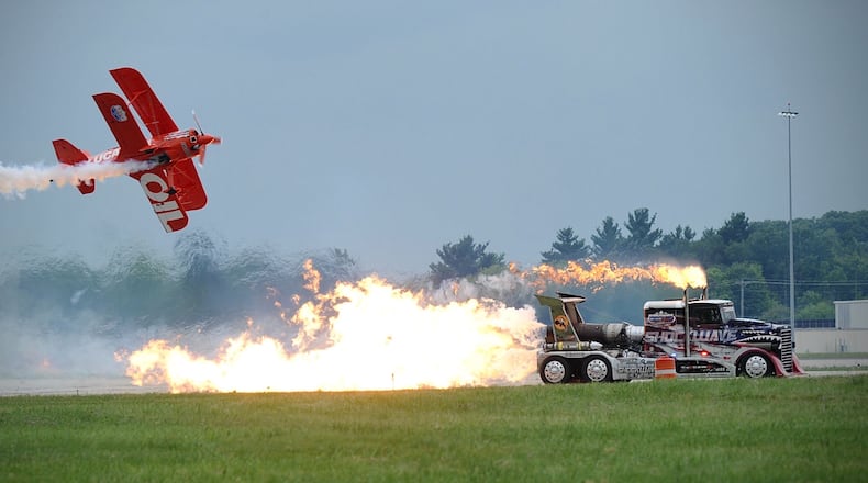 Shockwave, the world’s fastest truck with three jet engines, races the Lucas Oil biplane at the Center Point Energy Dayton Air Show. Saturday, July 10, 2021. MARSHALL GORBY\STAFF