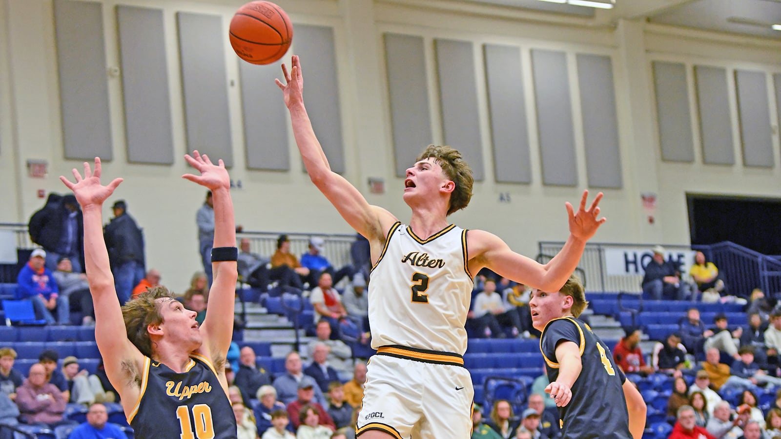 Alter's Grant Guess puts up a shot in the lane after being fouled by Upper Arlington's Hayden Henry during the Knights' 49-46 loss Sunday night in Flyin' To The Hoop at Trent Arena. Jeff Gilbert/CONTRIBUTED