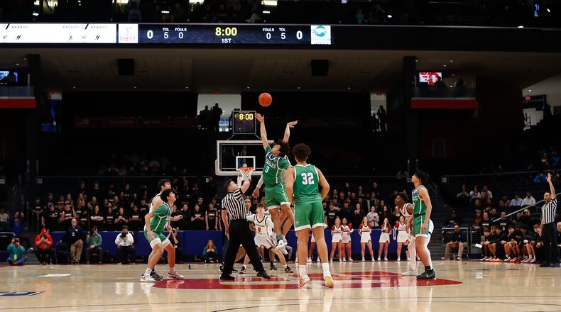 The Chaminade Julienne boys basketball team tips off against Rocky River Lutheran West in a Division II state semifinal at UD Arena on Friday, March 17, 2023. CONTRIBUTED BY MICHAEL COOPER