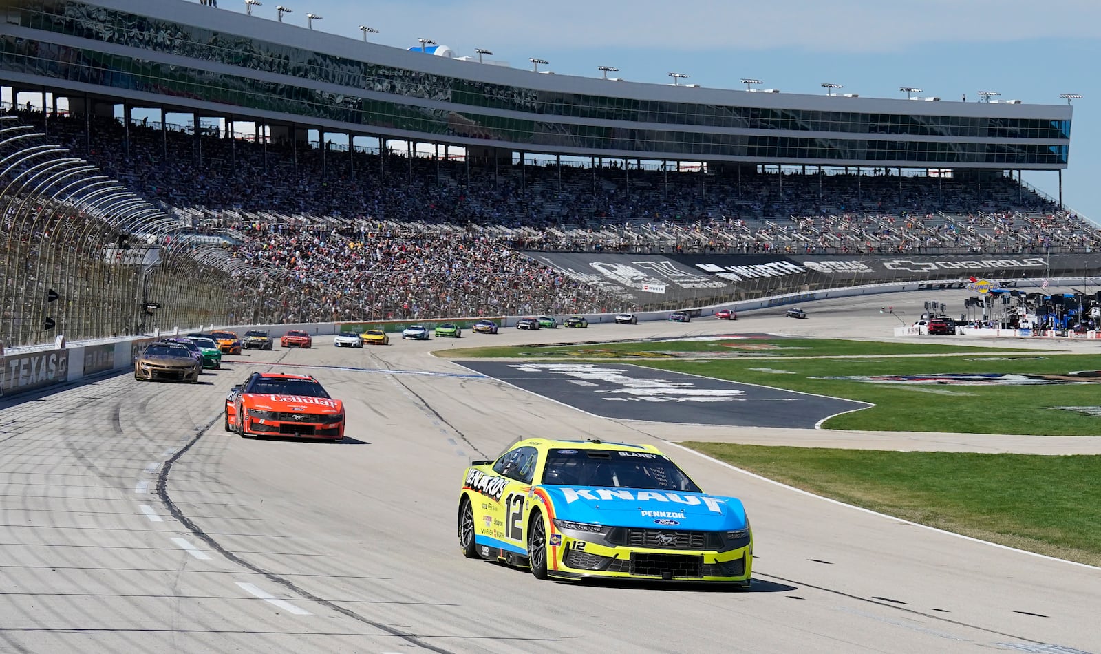 Ryan Blaney (12) heads into Turn 1 during a NASCAR Cup Series auto race at Texas Motor Speedway in Fort Worth, Texas, Sunday, May 4, 2025. (AP Photo/Larry Papke)