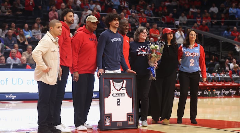 Dayton's Nate Santos is honored on Senior Day before a game against Richmond on Saturday, March 1 2025, at UD Arena. David Jablonski/Staff