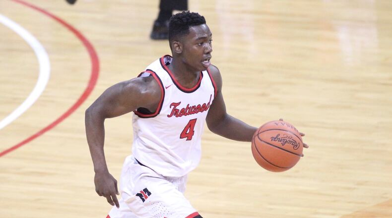 Trotwood-Madison’s Myles Belyeu brings the ball up the court against Akron St. Vincent-St. Mary in the Division II state championship game on Saturday, March 24, 2018, at the Schottenstein Center in Columbus. David Jablonski/Staff