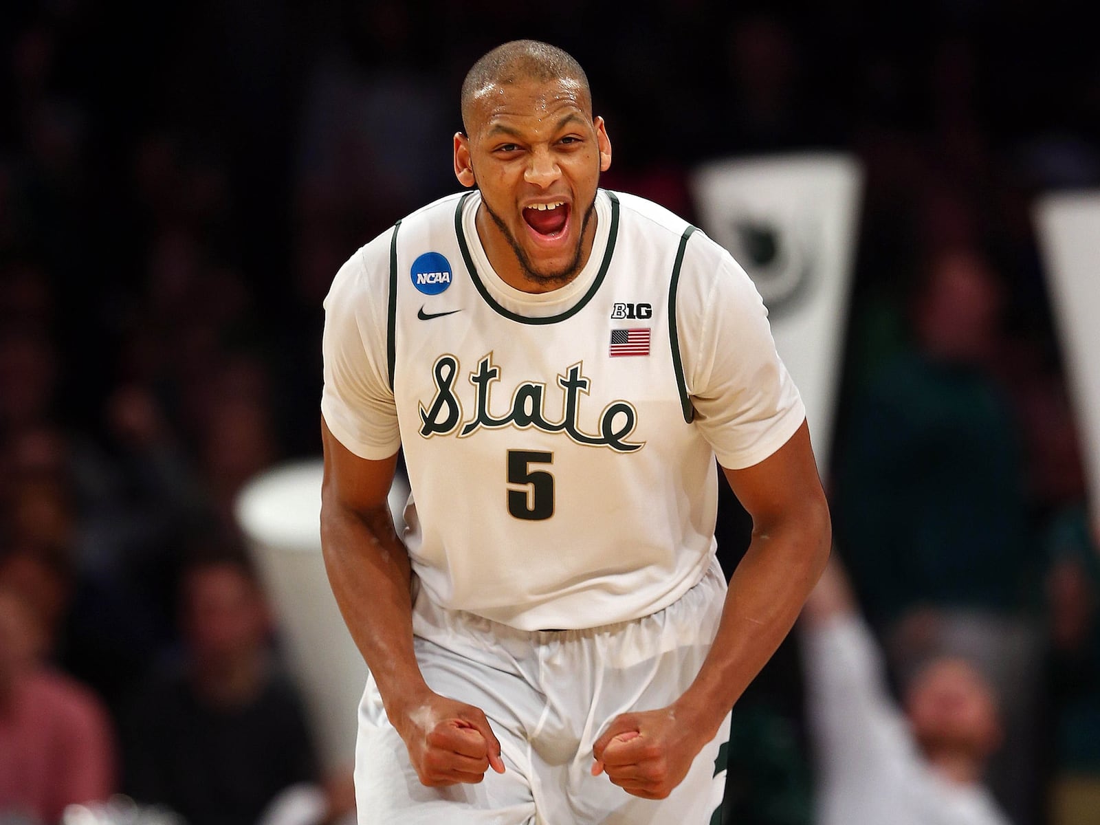 NEW YORK, NY - MARCH 30: Adreian Payne #5 of the Michigan State Spartans reacts after a basket in the second half against the Connecticut Huskies during the East Regional Final of the 2014 NCAA Men's Basketball Tournament at Madison Square Garden on March 30, 2014 in New York City. (Photo by Elsa/Getty Images)