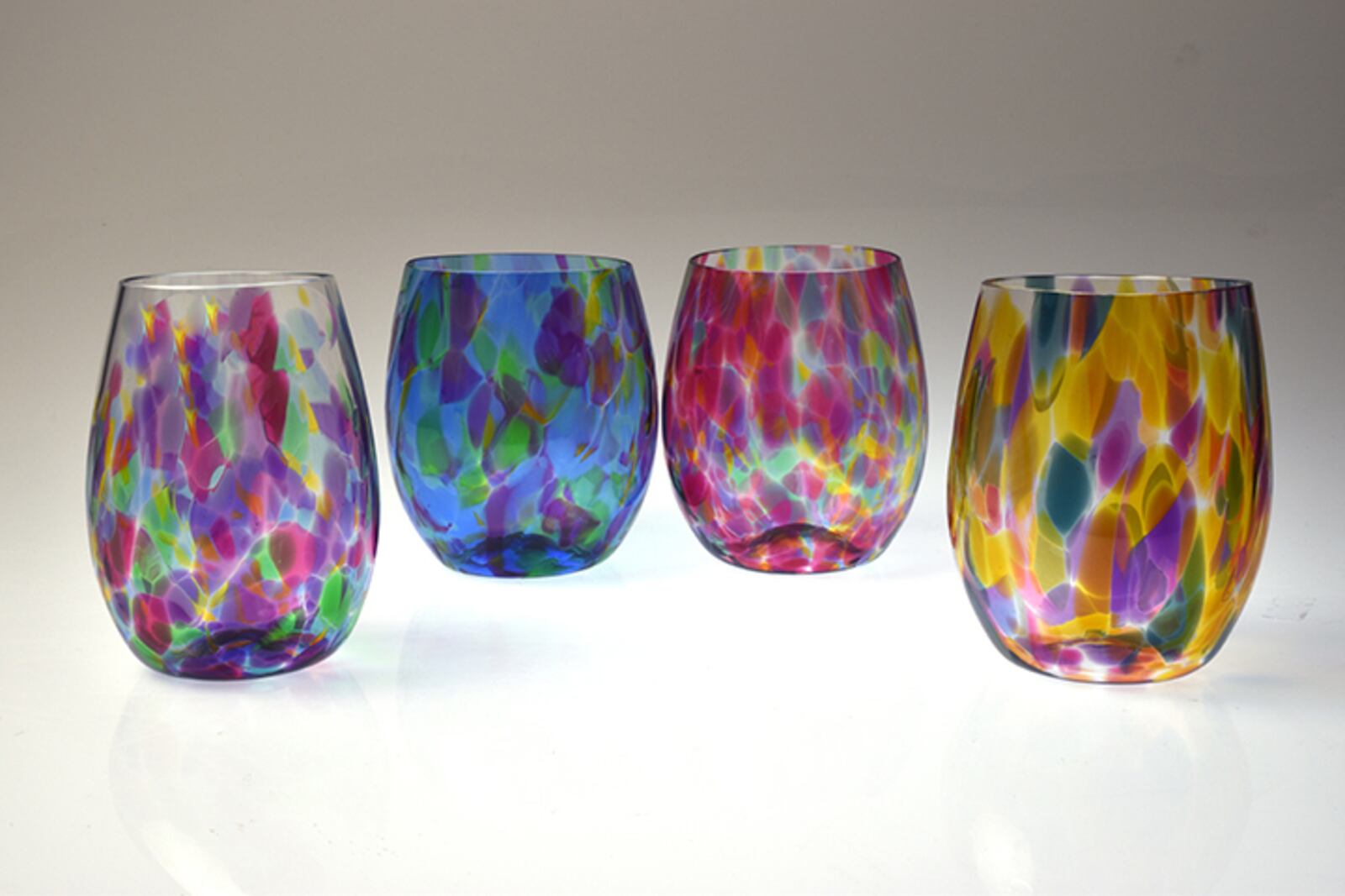 Wine glasses created by artist Nadine Saylor will be among the gifts available at The Contemporary Dayton's online shop, The Holiday Co-Share. CONTRIBUTED PHOTO