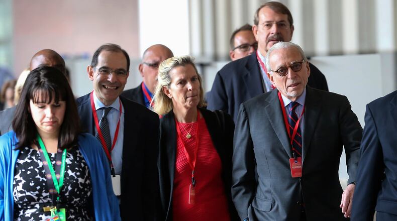 Trian Partners hedge fund manager Nelson Peltz, right, and other attendees walk into the Procter & Gamble headquarters for the annual shareholders meeting, Tuesday. (Kareem Elgazzar/The Cincinnati Enquirer via AP)