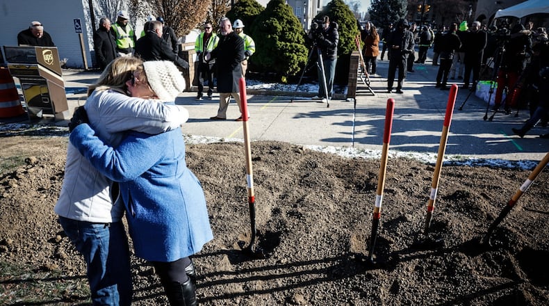 Xenia Mayor Sarah Mays, right, hugs Xenia resident Tobia Pierce after the groundbreaking of The Market District development Thursday, Dec. 12, 2024. The $140 million project will replace the Xenia Towne Square and serve as the town's commercial and residential center with a new hotel, townhomes and retail stores. JIM NOELKER/STAFF