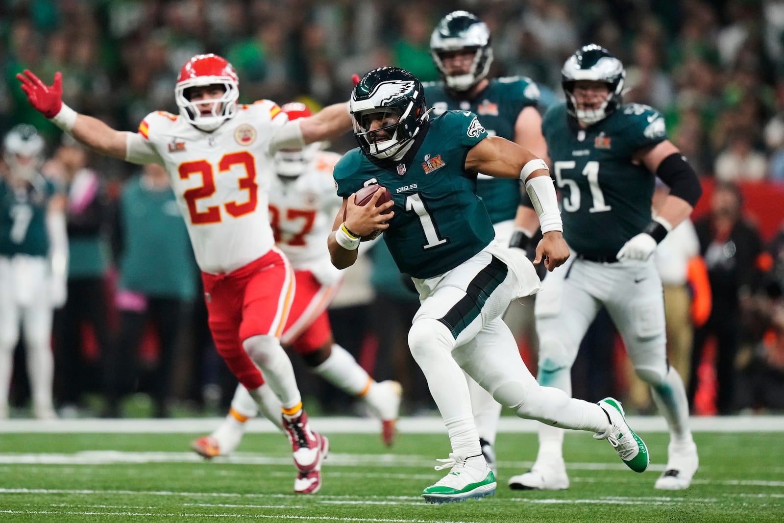 FILE - Philadelphia Eagles quarterback Jalen Hurts (1) runs the ball against the Kansas City Chiefs during the second half of the NFL Super Bowl 59 football game, Sunday, Feb. 9, 2025, in New Orleans. (AP Photo/Brynn Anderson, File)