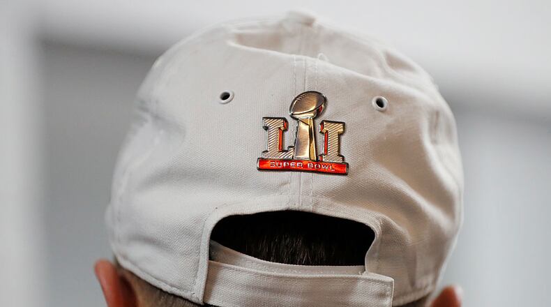 ATLANTA, GA - JANUARY 22: Matt Ryan #2 of the Atlanta Falcons wears a Super Bowl LI hat in the locker room after defeating the Green Bay Packers in the NFC Championship Game at the Georgia Dome on January 22, 2017 in Atlanta, Georgia. The Falcons defeated the Packers 44-21. (Photo by Kevin C. Cox/Getty Images)