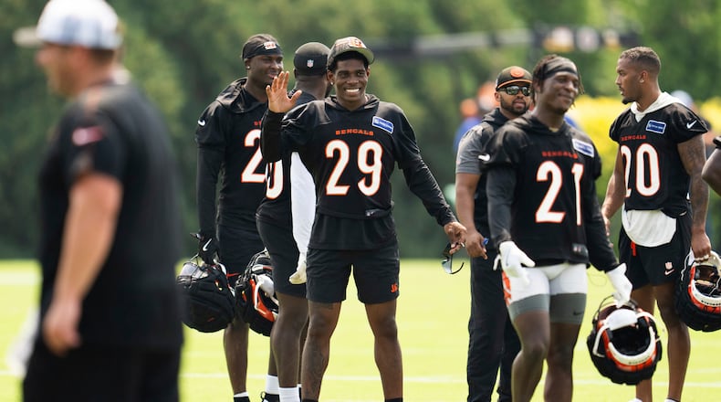 Cincinnati Bengals cornerback Cam Taylor-Britt (29) waves to a teammate during the NFL football team's training camp on Wednesday, July 24, 2024, in Cincinnati. (AP Photo/Emilee Chinn)