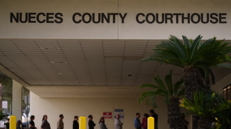 A line forms at the Nueces County Courthouse in Corpus Christi, Texas, as jury selection continues in the trial for former Uvalde school district police officer Adrian Gonzales, Monday, Jan. 5, 2026. (AP Photo/Eric Gay)