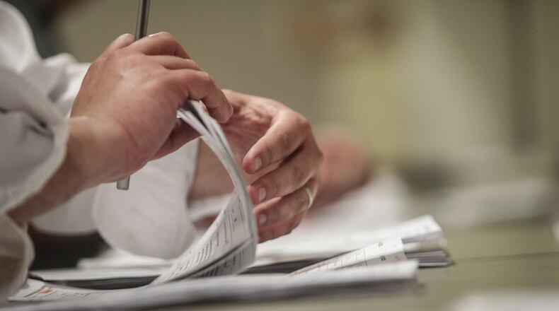 Local election officials say voters need to make sure they include all the required information on absentee ballot request forms and pay close attention to unsolicited request forms they get in the mail. JIM NOELKER/STAFF